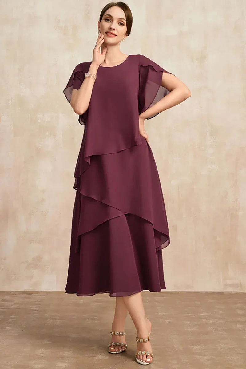FJØRNA classic white chiffon dress with flowing fabric and elegant design, perfect for formal or semi-formal occasions.