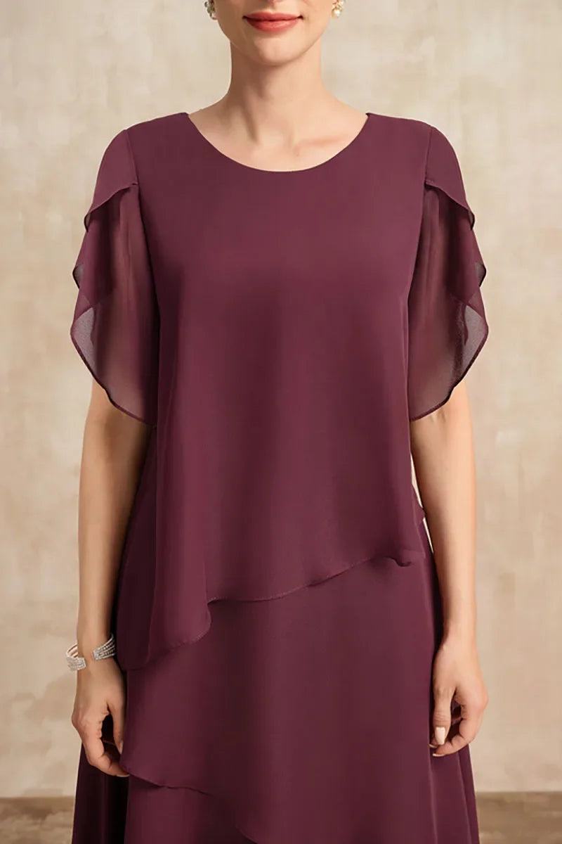 Elegant white chiffon dress by FJØRNA featuring a flowing, lightweight fabric and classic design, perfect for formal occasions.