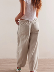 FJØRNA women's cotton pull-on jeans, casual pants with a comfortable fit, shown in a neutral color on a model.