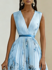 FJØRNA women's white sleeveless pleated V-neck dress with printed design, stylish and flowy for summer or casual wear.
