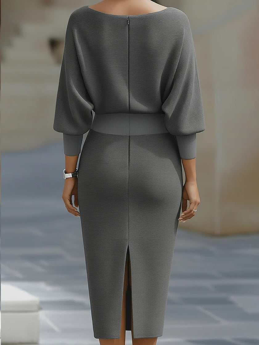 White FJØRNA dress with bat sleeves, waist-cinching design, and elegant, fashionable style in a pure color.