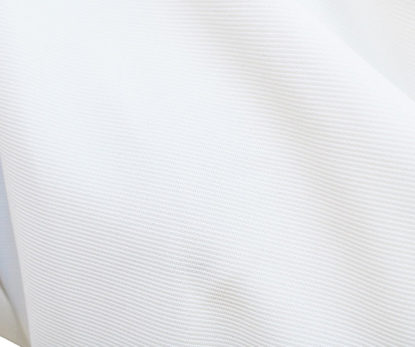 White FJØRNA bat sleeve waist-cinching dress with elegant design, featuring fashionable bat sleeves and a sleek silhouette.