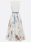 Women's white printed V-neck sleeveless pleated dress by FJØRNA, showing stylish design and flowy fabric.