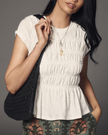 FJØRNA women's linen peplum blouse with long sleeves and V-neck, white, lightweight and breathable for casual wear.