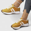 FJØRNA Danyzheiah orthopedic sneakers showing a close-up of white supportive shoes with cushioned soles and ergonomic design.