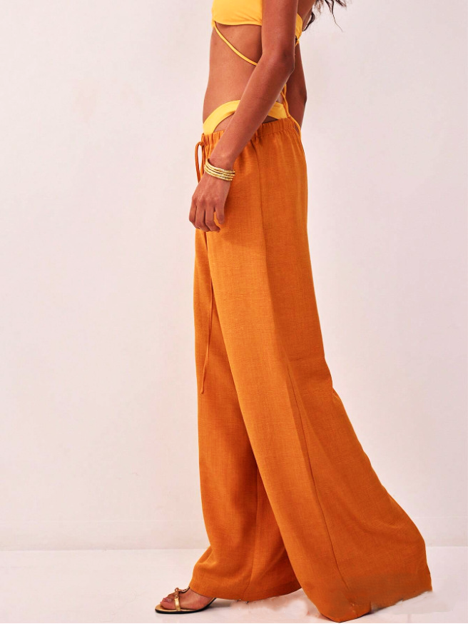 FJØRNA linen blend wide leg trousers for women with drawstring waist, lightweight and relaxed fit, in neutral fabric.