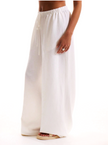 FJØRNA linen blend wide-leg trousers for women with drawstring waist, relaxed fit, and lightweight fabric.