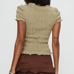 Women's plaid top by FJØRNA featuring ruffle details and long sleeves, stylish casual top for women.