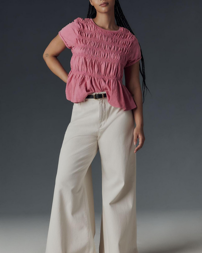 FJØRNA linen peplum blouse for women, stylish and breathable top with a fitted bodice and flared hem, in a soft natural linen fabric.