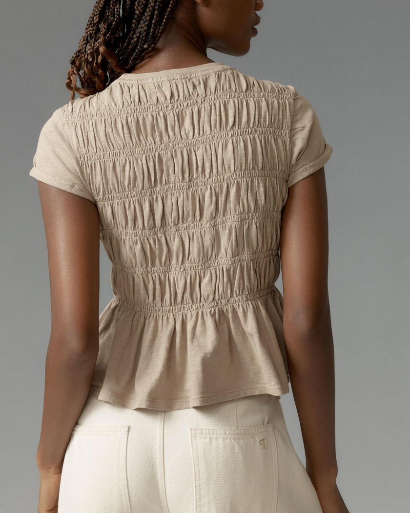 FJØRNA women's linen peplum blouse featuring a relaxed fit, short sleeves, and a stylish, breathable fabric design.