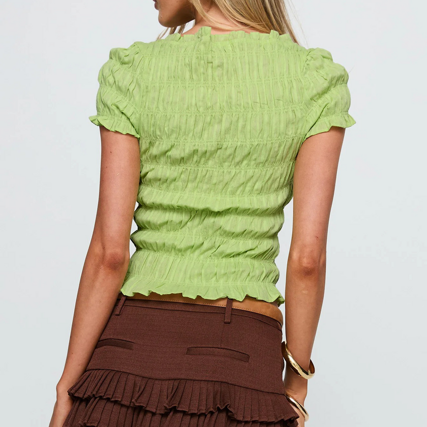 Women’s plaid top by FJØRNA featuring ruffle details and a stylish design, perfect for casual or trendy outfits.