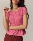 FJØRNA women's linen top with ruffle detail, featuring a lightweight, casual design and soft fabric perfect for warm weather.