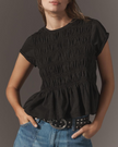 FJØRNA women's linen top with ruffle detail, featuring a lightweight, breezy design perfect for casual summer wear.