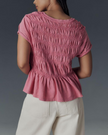 FJØRNA women's linen top with ruffle detail, lightweight and breathable, featuring a stylish design and feminine accents.