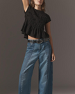 FJØRNA women's linen top with ruffle detail, lightweight and breezy, featuring a relaxed fit and elegant design.