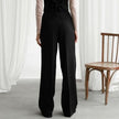 FJØRNA lightweight summer high waist wide-leg pleated trousers for women, showing relaxed fit and flowing fabric.