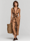 FJØRNA women's linen jumpsuit with collared V-neck, self-tie waist, designed for resort style, featuring lightweight, breathable fabric.
