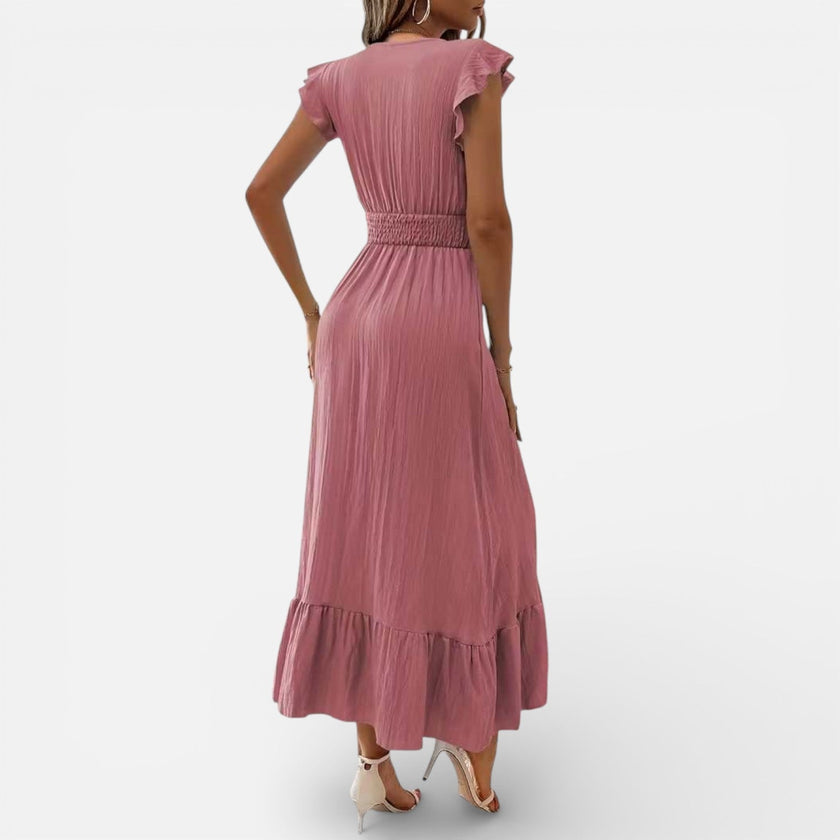 Women's sleeveless maxi dress by FJØRNA featuring a flowy fit and timeless style, perfect for elegant summer occasions.