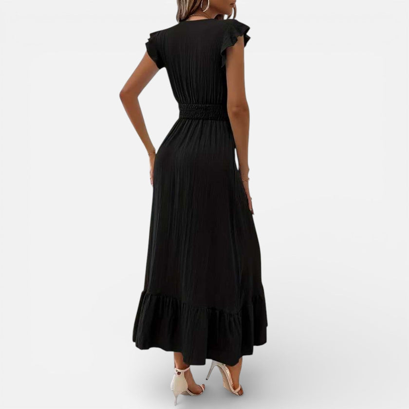 Women's sleeveless maxi dress by FJØRNA featuring a flowy fit and timeless style, perfect for elegant summer wear.