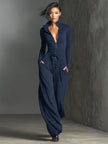 Sparkling knit women's jumpsuit by FJØRNA with zip front, long sleeves, and wide-leg pants, styled for a modern, elegant look.