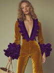 Gold velvet flared sleeve evening jumpsuit for women by FJØRNA, featuring a stylish fitted silhouette and dramatic flared sleeves.