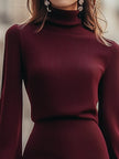 FJØRNA burgundy ribbed turtleneck mini dress with balloon sleeves, showcasing a fitted silhouette and stylish design.