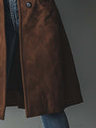 Brown vintage suede trench coat for women by FJØRNA, featuring classic design and textured fabric.