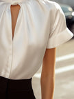 FJØRNA satin women’s high neck keyhole short sleeve blouse with a smooth, shiny fabric and elegant design.