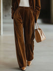 Brown vintage velvet tailored trousers with pockets by FJØRNA, featuring a classic fit and stylish design.