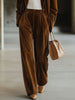Brown vintage velvet tailored trousers with pockets by FJØRNA, featuring a classic fit and stylish design.