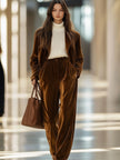 Brown vintage velvet tailored trousers with pockets from FJØRNA, displayed on a white background.