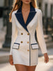FJØRNA white double-breasted blazer dress with navy lapel, tailored fit, and long sleeves, styled with a sleek, modern look.