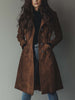 Brown vintage suede trench coat for women by FJØRNA, shown on a model with classic collar and belted waist.