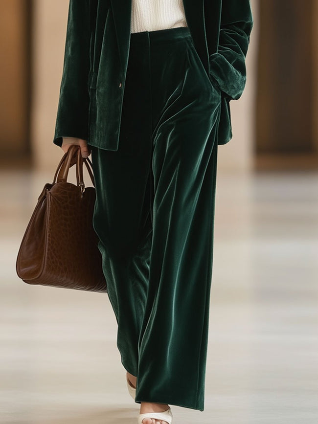 Dark green vintage velvet tailored trousers with pockets by FJØRNA, featuring a classic fit and refined design.