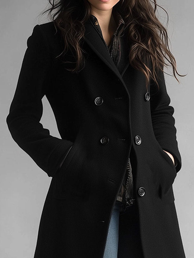 Black midi wool coat for women by FJØRNA, featuring a tailored fit and functional pockets, perfect for chilly weather.