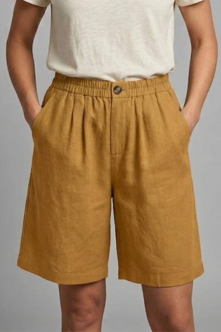 FJØRNA Juniper women's relaxed fit shorts with elastic waistband, casual style, lightweight fabric, and comfortable fit.