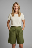Light beige women's relaxed fit shorts with elastic waistband from FJØRNA, featuring a casual and comfortable style.