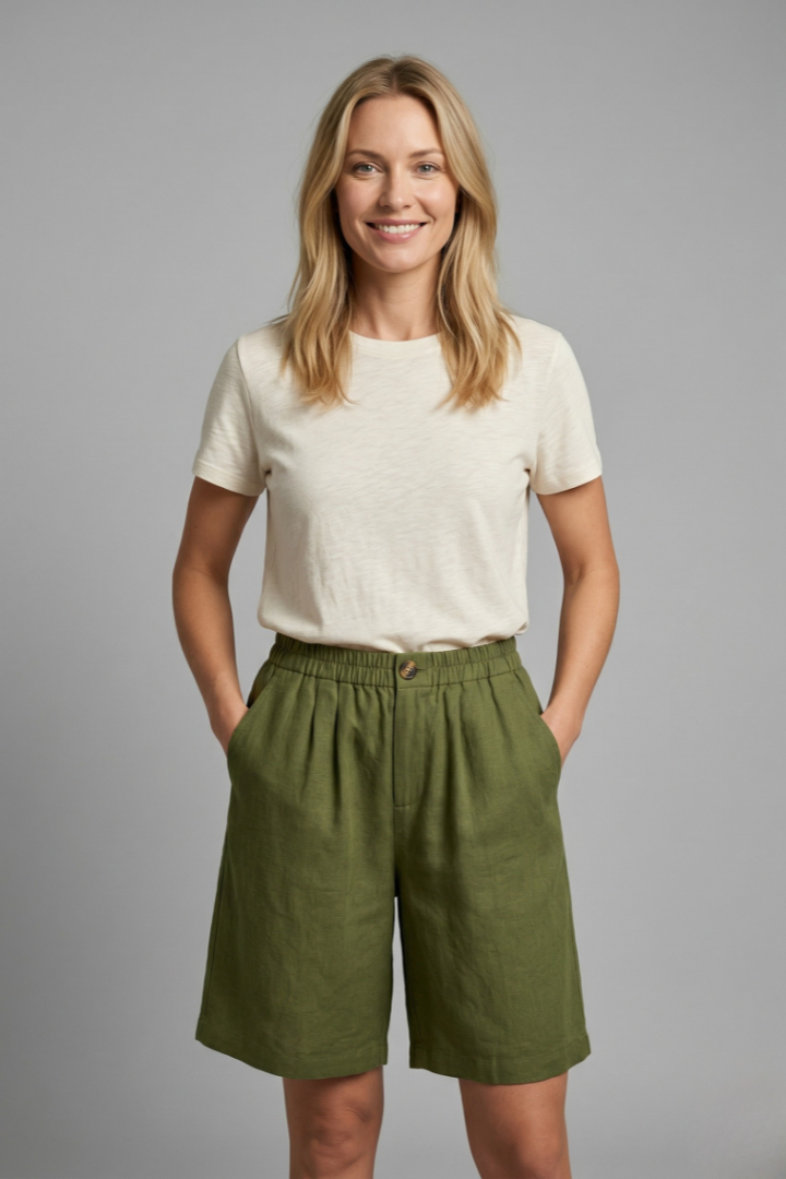 Light beige women's relaxed fit shorts with elastic waistband from FJØRNA, featuring a casual and comfortable style.
