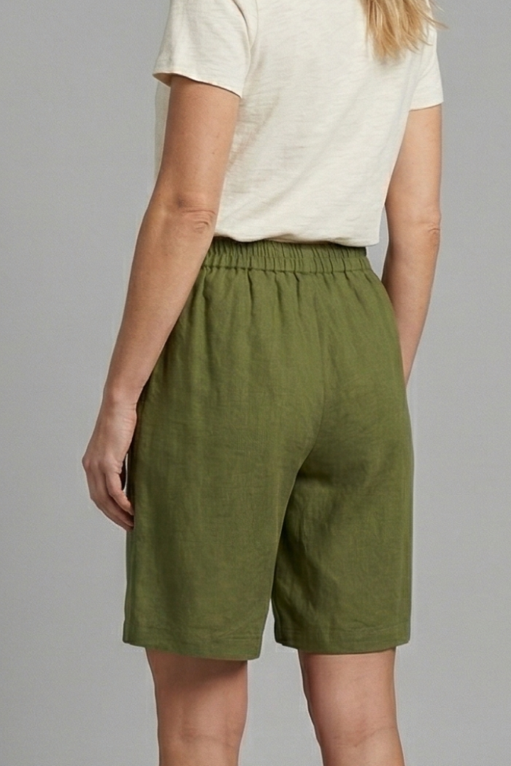 FJØRNA Juniper women's relaxed fit shorts with elastic waistband, casual style, lightweight fabric, and comfortable fit.