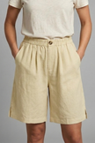 FJØRNA Juniper women's relaxed fit shorts with elastic waistband, lightweight and comfortable for casual wear, shown in natural fabric.