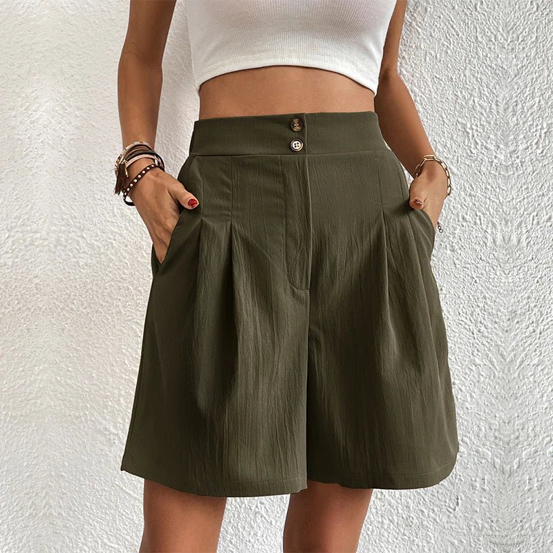 FJØRNA women's lightweight summer shorts with high waist, wide leg, and pleated design shown on a model.