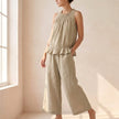 Khaki FJØRNA women's two-piece co-ord set with ruffle high neck top and matching pants, stylish and elegant for modern fashion.