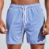 Men's casual striped boardshorts by FJØRNA with a drawstring, side slit hem, and classic blue stripe pattern.