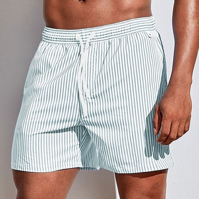 Light green casual striped FJØRNA men's boardshorts with drawstring and side slit hem, perfect for beach and pool wear.