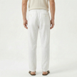 Men's linen drawstring trousers by FJØRNA, lightweight men's pants with a relaxed fit and casual style, shown in neutral color