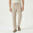 Men's linen drawstring trousers by FJØRNA, featuring lightweight fabric, relaxed fit, and adjustable waistband on neutral background.