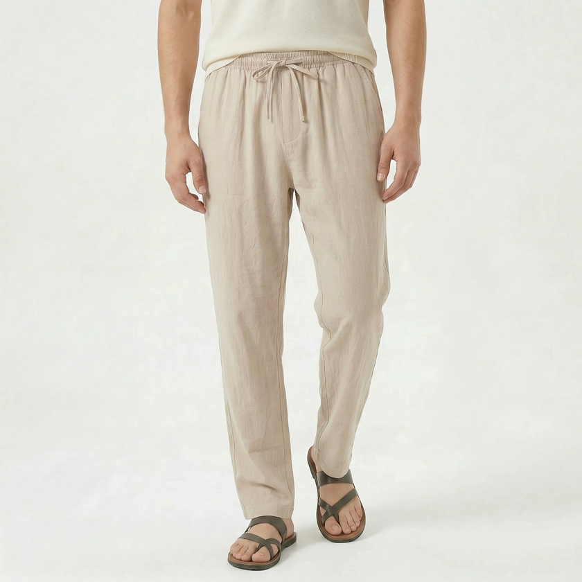 Men's linen drawstring trousers by FJØRNA, featuring lightweight fabric, relaxed fit, and adjustable waistband on neutral background.