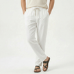 Men's linen drawstring trousers by FJØRNA, featuring lightweight, breathable fabric and relaxed fit for casual wear.