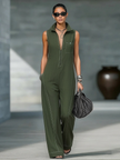 Loose-fit women's sleeveless jumpsuit by FJØRNA with contrast trim and wide-leg pants, shown in a natural pose.
