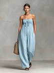 FJØRNA linen blend strapless women's jumpsuit with loose fit and tie closure, displayed on a hanger against a plain background.
